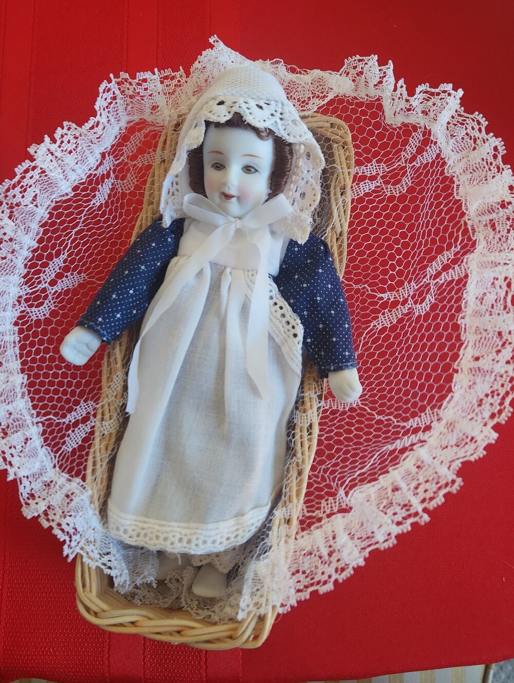 Porcelain Baby Doll in White Dress with Navy Sleeves